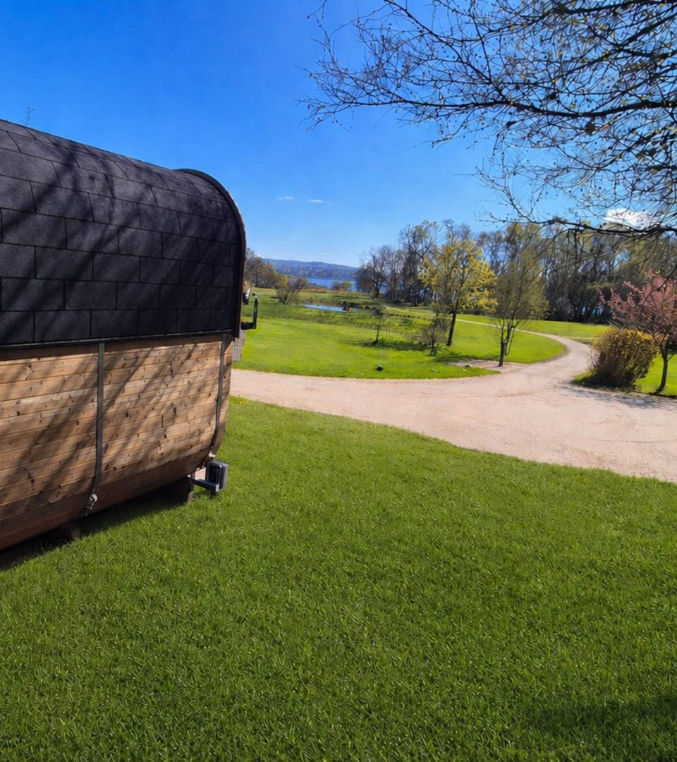 An exterior shot of Loch Lomond Waterfronts wild sauna looking down the nature reserve to Loch Lomond.